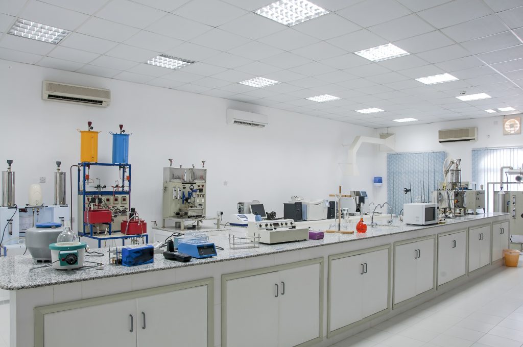 Baikon R&D laboratory testing acrylic court flooring, a key part of our sports court materials